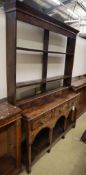 A small George III and later oak dresser, W.125cm, D.36cm, H.184cmCONDITION: Overall a very nice