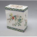 A Chinese famille rose pillow, late 19th century, height 15cmCONDITION: Generally a little worn to