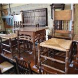 A pair of spindleback rush seat chairs and an Arts and Crafts side table, table W.57cm