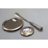 Two circular silver mounted photograph frames, largest 16.4cm and a white metal handled shoe horn.