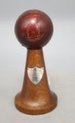 A mid 20th century cricket trophy, with silver plaque, height 18cm