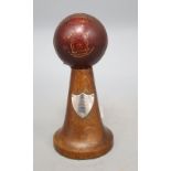 A mid 20th century cricket trophy, with silver plaque, height 18cm