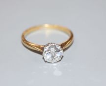 An 18ct and solitaire diamond ring, the round brilliant cut stone weighing approximately 1.10ct,