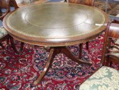 A reproduction George III style circular mahogany leather topped library table, 120cm diameter, H.