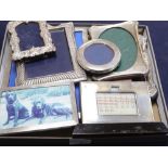 Eight assorted George V and later silver mounted photograph frames and desk calendar, largest 24.