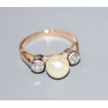 A yellow metal, single cultured pearl and two stone diamond ring, size K/L, gross 3.9 grams, pearl