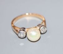 A yellow metal, single cultured pearl and two stone diamond ring, size K/L, gross 3.9 grams, pearl