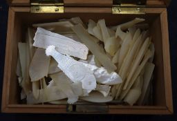 A collection of mother of pearl gaming counters in a Chinese carved box