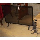 A Victorian wrought iron mesh fire screen, W.90cm together with a pair of cast iron fire dogs