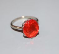 A 9ct white metal and oval cut fire opal? set dress ring, size N, gross 2.9 grams.CONDITION: Some