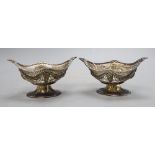 A pair of late Victorian pierced silver oval bonbon baskets by Charles Stuart Harris, London,