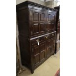 An 18th century oak press cupboard, W.130cm, D.53cm, H.183cm