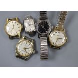 Four lady's Omega watches and a lady's Zenith watch.