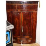 A George III mahogany bowfront hanging corner cabinet, W.86cm, D.48cm, H.126cm