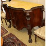 A George III style serpentine mahogany commode with faux marble top, W.145cm, D.59cm, H.