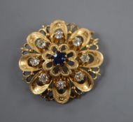 A French yellow metal (poincon mark for 18ct), sapphire and diamond set flower head pendant