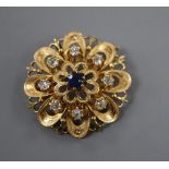 A French yellow metal (poincon mark for 18ct), sapphire and diamond set flower head pendant