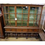 An early 20th century George I style parcel gilt walnut display cabinet, W.148cm, D.44cm, H.