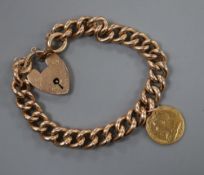 An early 20th century 9ct curblink bracelet, hung with an 1899 gold half sovereign, gross 28.8