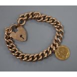 An early 20th century 9ct curblink bracelet, hung with an 1899 gold half sovereign, gross 28.8