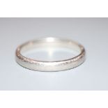 A Tiffany & Co platinum wedding band, size R/S, 5.8 grams.CONDITION: Shank is very scratched