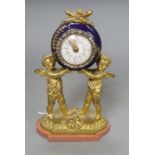 A French gilt metal and enamel cherub timepiece, height 18.5cm