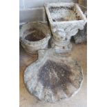 Two reconstituted stone garden planters together with a scalloped shell bird bath, bird bath W.64cm,