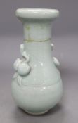 A 17th century Chinese celadon glazed vase, height 26.5cm (a.f) and a pin dishCONDITION: The vase