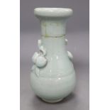 A 17th century Chinese celadon glazed vase, height 26.5cm (a.f) and a pin dishCONDITION: The vase