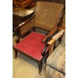 A pair of Regency style mahogany bergere armchairs (formerly from the Brighton Grand Hotel), W.63cm,