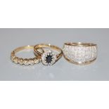 Two modern 9ct gold and diamond set dress rings and a 9ct gold sapphire and diamond cluster ring,