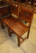 A pair of carved oak hall chairs