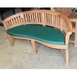 A teak banana garden bench, W.160cm, D.60cm, H.83cmCONDITION: A new condition