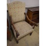 A pair of walnut tapestry Louis XIII style armchairs, W.58cm, D.60cm, H.110cm