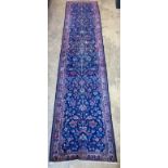 A Kerman blue ground runner, 355 x 77cm