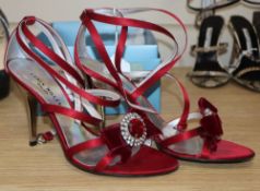 A pair of Karen Millen plum satin sandals with silver heels, cross strap ankle straps and diamonte