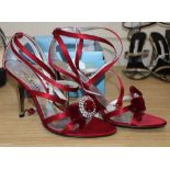 A pair of Karen Millen plum satin sandals with silver heels, cross strap ankle straps and diamonte