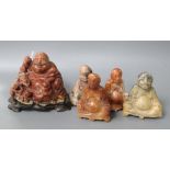 A hardstone Buddha on stand and four others, tallest 10cm