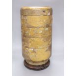 A 19th century Japanese sectional stack of mother of pearl and lacquered boxes, on hardwood stand,