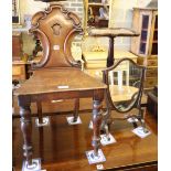 A Victorian carved oak hall chair and a skeleton framed toilet mirror