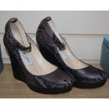 A pair of Jimmy Chou grey snakeskin high platform shoes with ankle strap, size 37.5