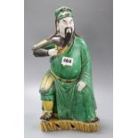 A Japanese pottery figure of a sage