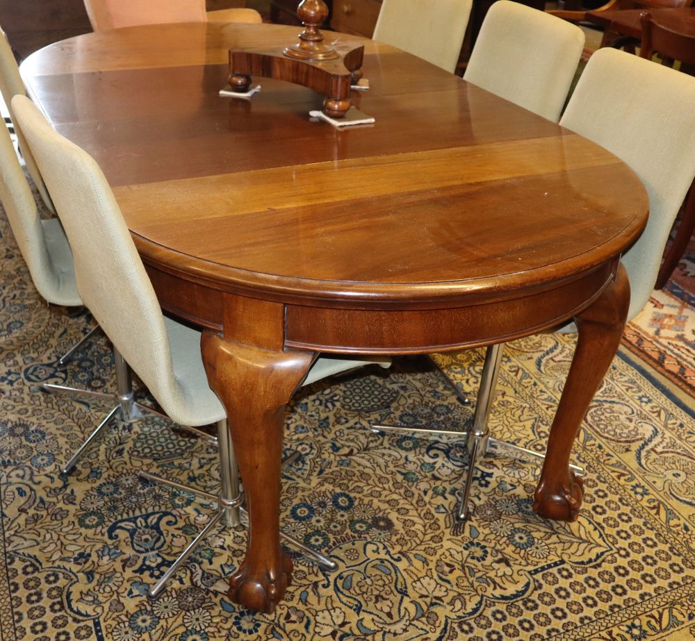 A 1920's mahogany extending dining table, two spare leaves, W.180cm extended, D.108cm, H.75cm