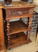 A late 19th century Flemish carved oak three tier side table, W.47cm, D.45cm, H.76cm