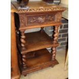 A late 19th century Flemish carved oak three tier side table, W.47cm, D.45cm, H.76cm