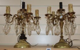 A pair of gilt four branch five light candelabra