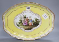 A Meissen porcelain figural painted dish, length 36cm