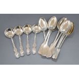 A set of six George V silver fiddle pattern dessert spoons, Sheffield, 1913, four sterling small