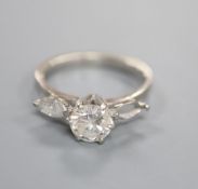 A modern 18ct gold and two (ex three) stone diamond ring, set with central round brilliant cut stone