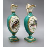 A pair of Coalport green glazed ewers, hand painted birds to the body, height 27cmCONDITION: One
